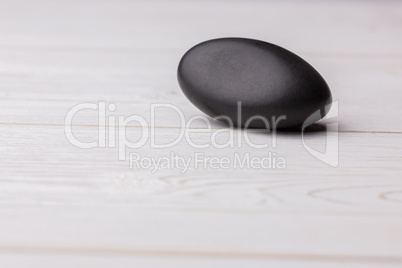 Pebble on a wooden table