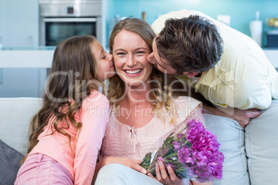 Daughter surprising mother with flowers