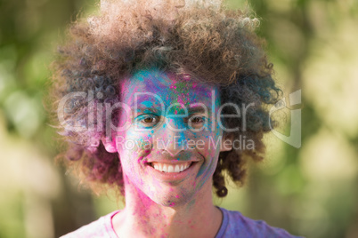 Young man covered in powder paint