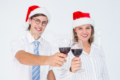 Happy geeky hipster couple drinking red wine