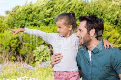 Father and daughter looking at something