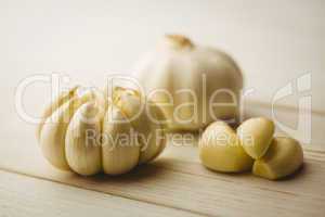 Garlic cloves and bulb on chopping board