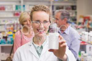 Pharmacist holding medicine jar