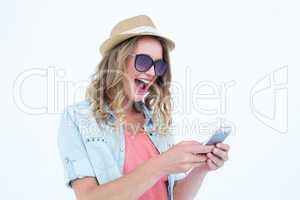 Smiling woman texting with her smartphone