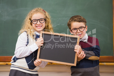 Pupils holding blackboard