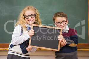 Pupils holding blackboard