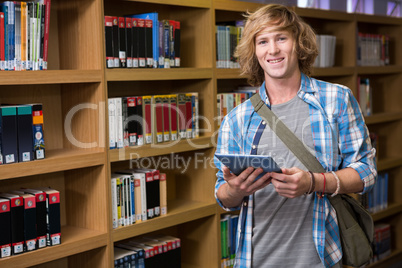 Student using tablet in library