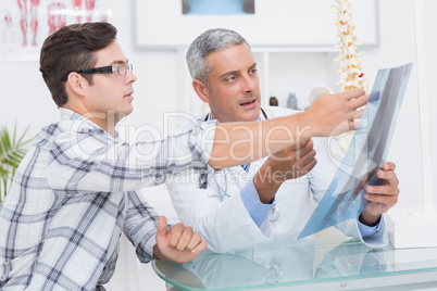 Doctor showing Xrays to his patient