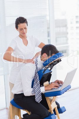 Businessman having head massage