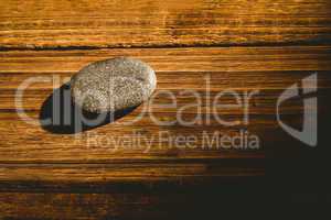 Pebble on a wooden table