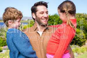 Happy family smiling at camera