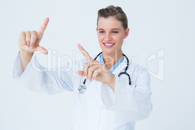 Doctor looking through finger frame