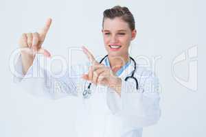 Doctor looking through finger frame