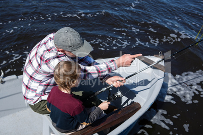 Happy man fishing with his son