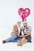 Geeky hipster in love couple looking at camera