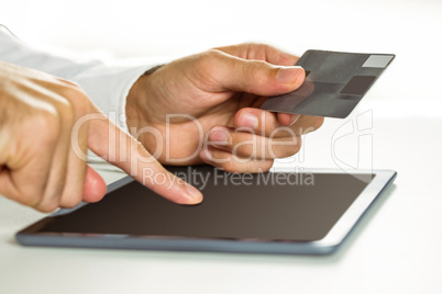 Man using tablet for online shopping