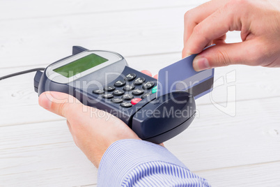 Man swiping his credit card