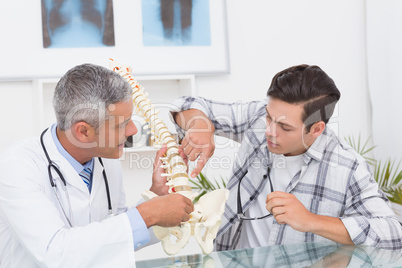 Doctor explaining the spine to a patient