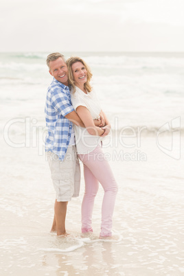 Casual couple smiling at camera