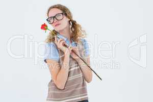 Geeky hipster woman holding rose