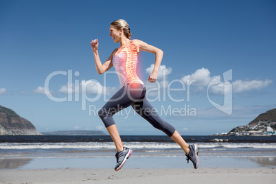 Highlighted back bones of jogging woman on beach