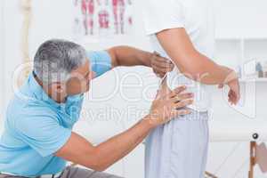 Doctor examining his patient back