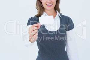 Smiling woman showing card