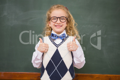 Happy pupil looking at camera with thumbs up