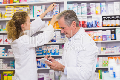 Pharmacists searching medicines with prescription