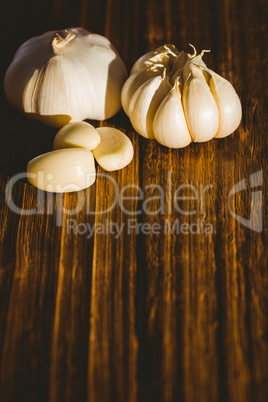 Garlic cloves and bulb on chopping board