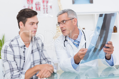 Doctor showing Xrays to his patient