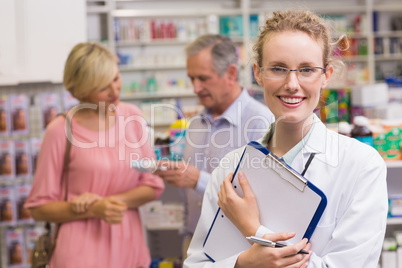 Pharmacist holding clipboard