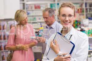 Pharmacist holding clipboard