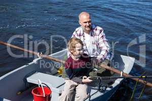 Happy man fishing with his son