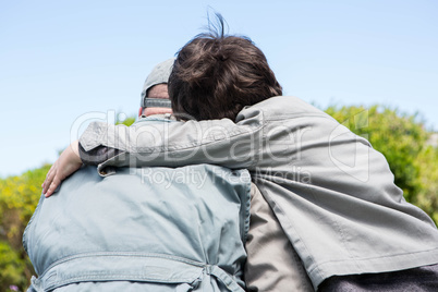 Father and son hugging