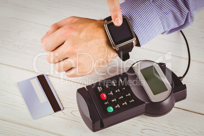 Man using smart watch to express pay