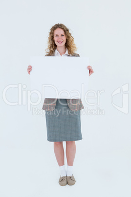 Hipster woman showing poster smiling at camera