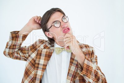 Geeky hipster scratching his head