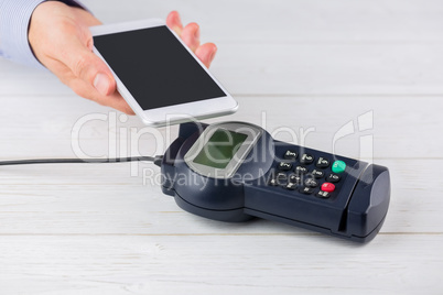 Man using smartphone to express pay