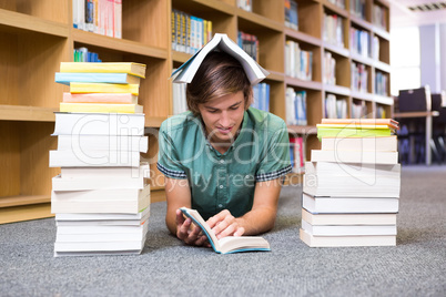 Student lying on library floor