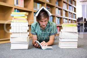 Student lying on library floor