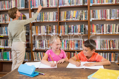 Teacher looking for a book at library