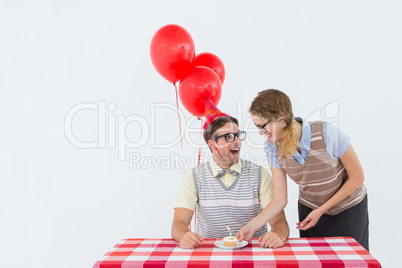 Geeky hipster couple celebrating his birthday