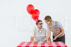 Geeky hipster couple celebrating his birthday