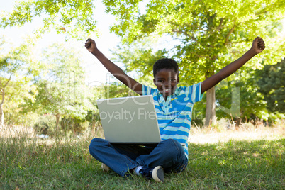 Cute little boy with laptop