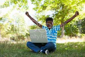 Cute little boy with laptop