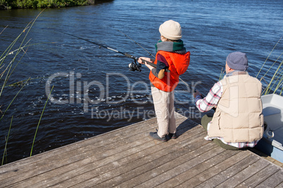 Happy man fishing with his son