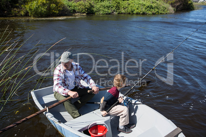 Happy man fishing with his son