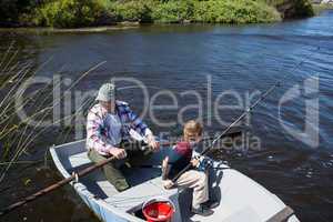 Happy man fishing with his son