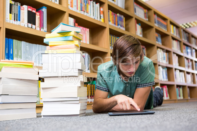 Student lying on library floor